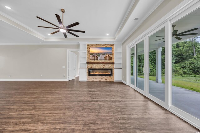 3995 Tillmond Dr, Conway, SC 29526 - unfurnished living room featuring ceiling fan, plenty of natural light, dark wood-style floors, crown molding, and baseboards
