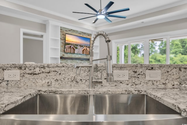 3995 Tillmond Dr, Conway, SC 29526 - detailed view of a sink, a ceiling fan, light stone counters, and backsplash
