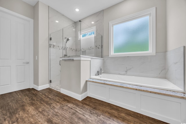 3995 Tillmond Dr, Conway, SC 29526 - bathroom with a stall shower, a garden tub, and wood finished floors