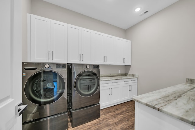 3995 Tillmond Dr, Conway, SC 29526 - laundry area featuring independent washer and dryer, cabinet space, dark wood-type flooring, and recessed lighting