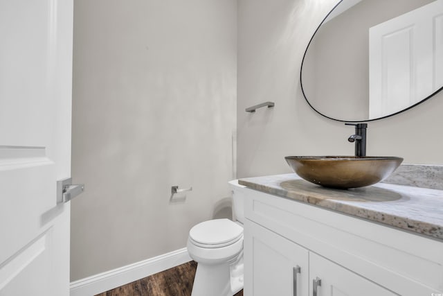 3995 Tillmond Dr, Conway, SC 29526 - bathroom with toilet, vanity, wood finished floors, and baseboards