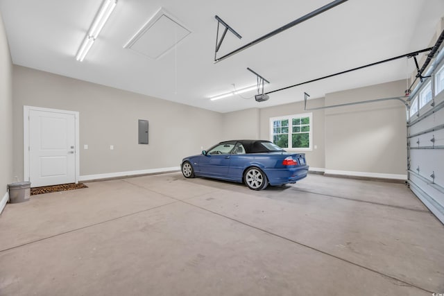3995 Tillmond Dr, Conway, SC 29526 - garage featuring a garage door opener, electric panel, and baseboards