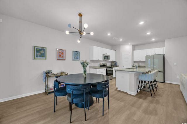 112 Carolina Lakes Blvd, Myrtle Beach, SC 29588 - dining area featuring light wood-type flooring, a chandelier, and recessed lighting