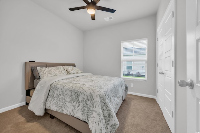 bedroom with carpet floors, baseboards, and a ceiling fan