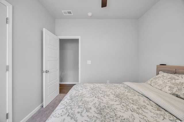 bedroom with carpet floors, baseboards, and a ceiling fan
