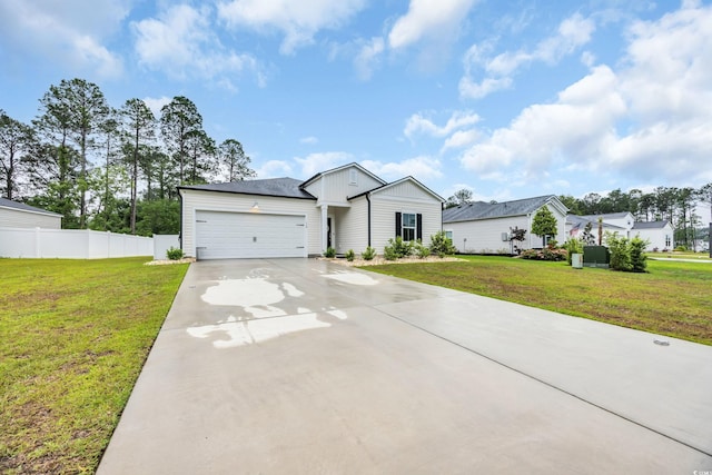 ranch-style home featuring driveway, an attached garage, and board and batten siding