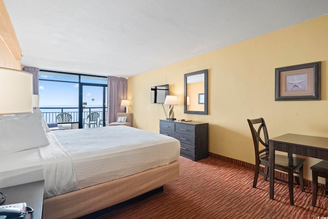 1501 S Ocean Blvd Unit 1231, Myrtle Beach, SC 29577 - carpeted bedroom featuring access to exterior, baseboards, and floor to ceiling windows