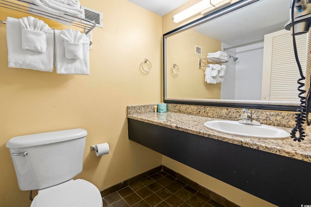 1501 S Ocean Blvd Unit 1231, Myrtle Beach, SC 29577 - bathroom with toilet, tile patterned flooring, baseboards, and vanity