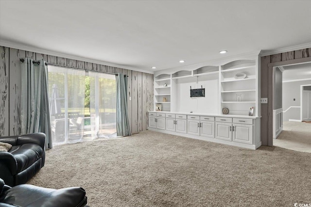 living area featuring ornamental molding, carpet floors, and recessed lighting