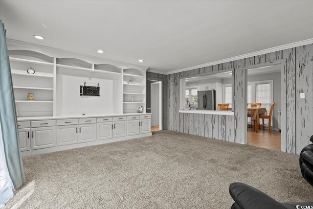 living room featuring wallpapered walls, ornamental molding, carpet, washer / clothes dryer, and recessed lighting