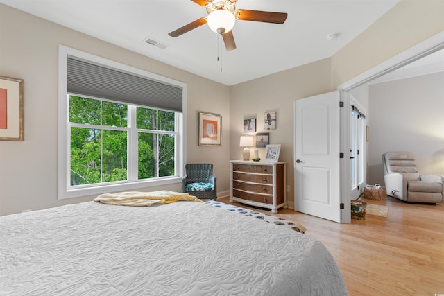 bedroom with wood finished floors and a ceiling fan