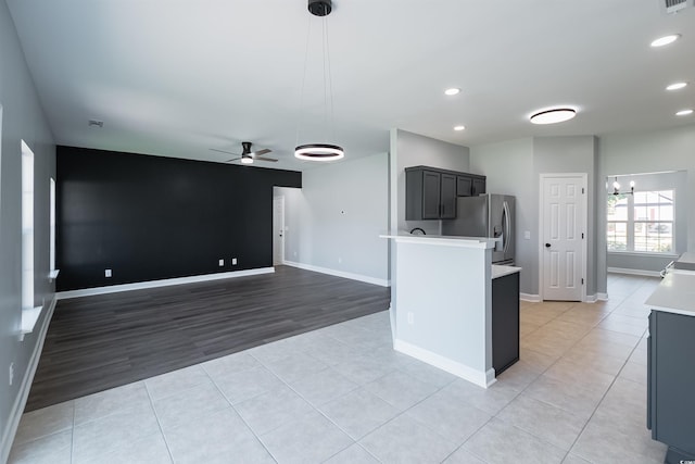 1031 Snowberry Dr, Longs, SC 29568 - kitchen with stainless steel fridge, a ceiling fan, light countertops, a chandelier, and recessed lighting