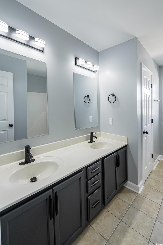 1031 Snowberry Dr, Longs, SC 29568 - bathroom with tile patterned flooring, double vanity, and baseboards
