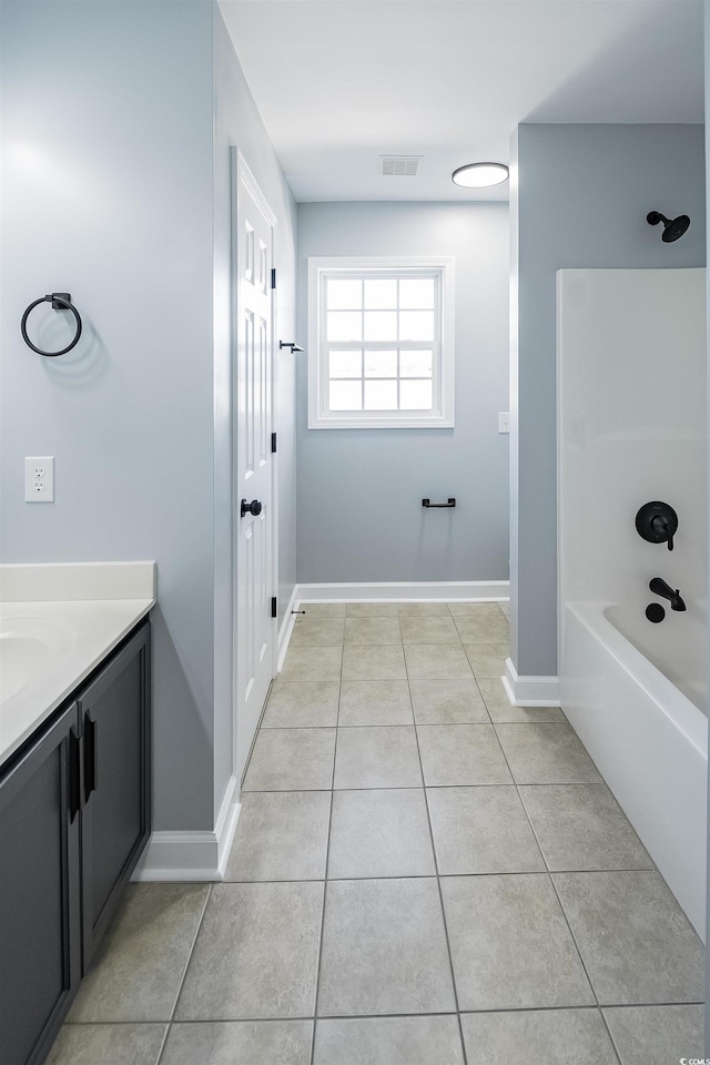 1031 Snowberry Dr, Longs, SC 29568 - full bath featuring tile patterned floors, vanity, baseboards, and shower / bath combination