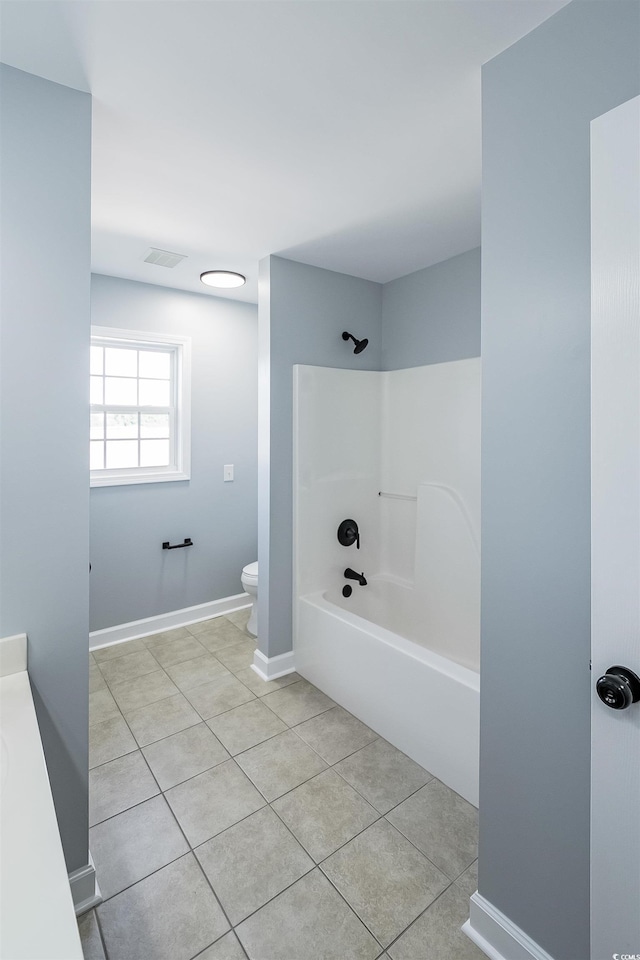 1031 Snowberry Dr, Longs, SC 29568 - bathroom featuring tile patterned flooring, toilet, bathing tub / shower combination, and baseboards