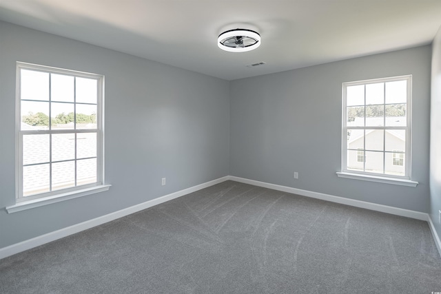 1031 Snowberry Dr, Longs, SC 29568 - empty room featuring dark colored carpet and baseboards