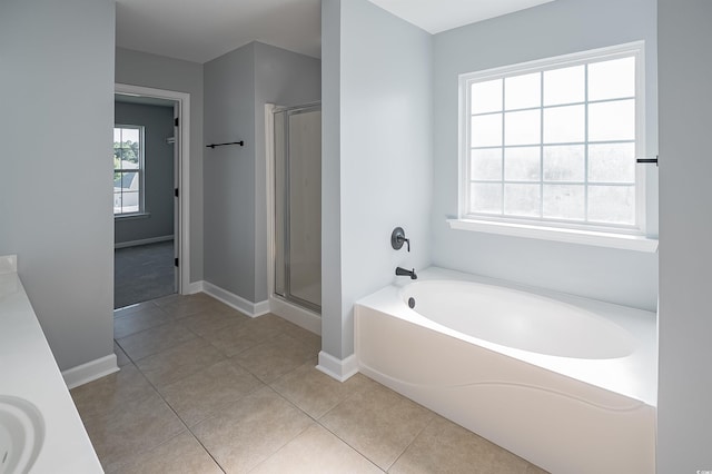 1031 Snowberry Dr, Longs, SC 29568 - full bathroom featuring a shower stall, a garden tub, tile patterned floors, and baseboards