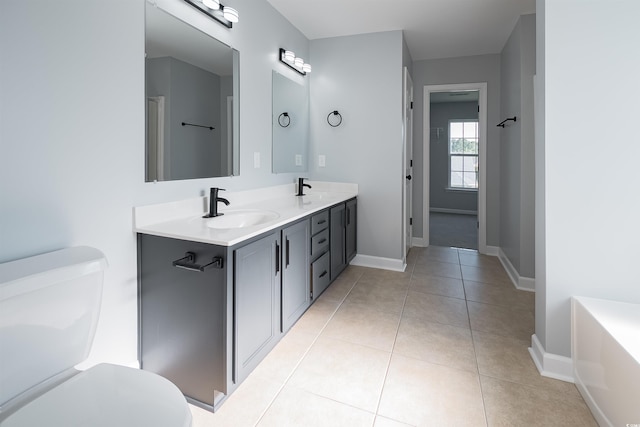 1031 Snowberry Dr, Longs, SC 29568 - full bathroom with toilet, baseboards, double vanity, and tile patterned floors