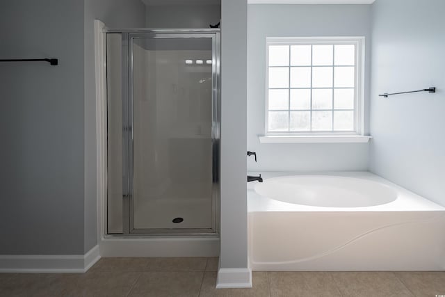 1031 Snowberry Dr, Longs, SC 29568 - bathroom featuring tile patterned floors, a shower stall, a bath, and baseboards