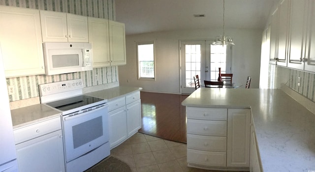 131 Goodale Dr, Longs, SC 29568 - kitchen featuring white appliances, light countertops, a chandelier, and white cabinets