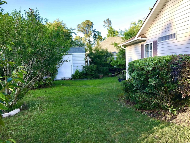131 Goodale Dr, Longs, SC 29568 - view of grassy yard featuring a shed and an outbuilding
