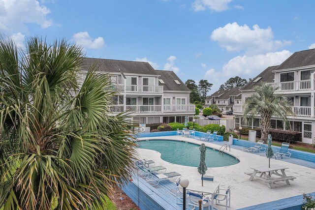 3700 Golf Colony Ln Unit 6J, Little River, SC 29566 - community pool with a residential view and a patio