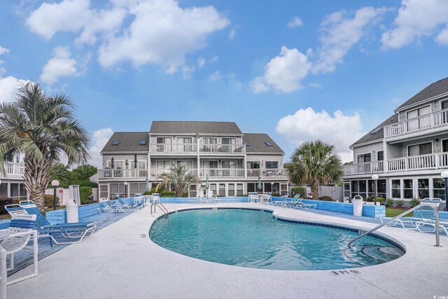 3700 Golf Colony Ln Unit 6J, Little River, SC 29566 - community pool featuring a patio