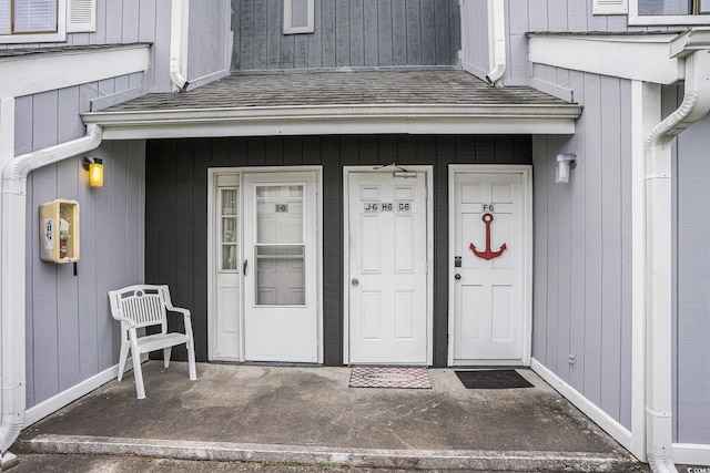 3700 Golf Colony Ln Unit 6J, Little River, SC 29566 - doorway to property featuring roof with shingles