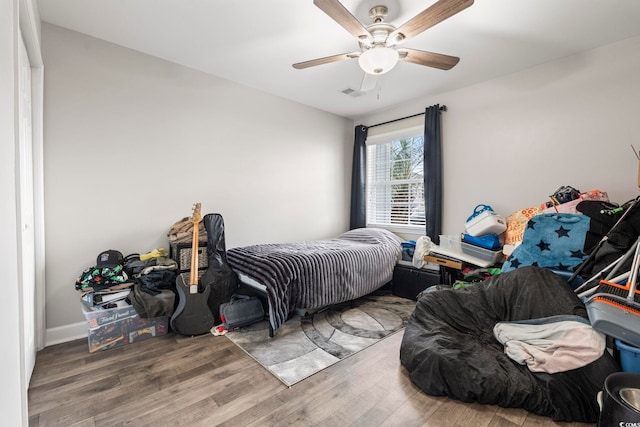 bedroom with wood finished floors and ceiling fan