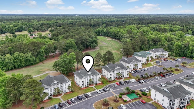 aerial view of a forest and a golf course
