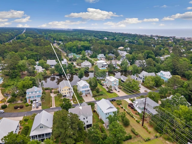 aerial view of residential area with a nearby body of water