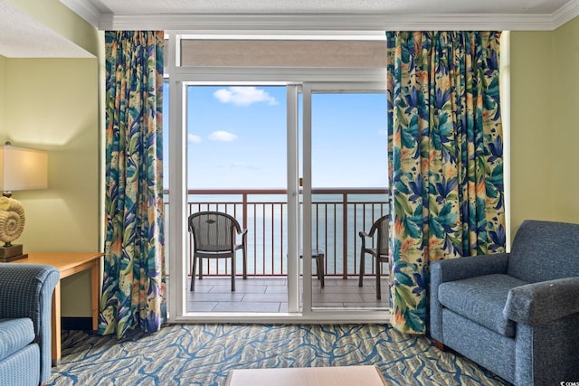 sitting room featuring a water view and ornamental molding