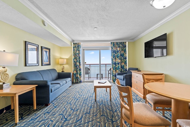 living area with ornamental molding, a textured ceiling, and carpet