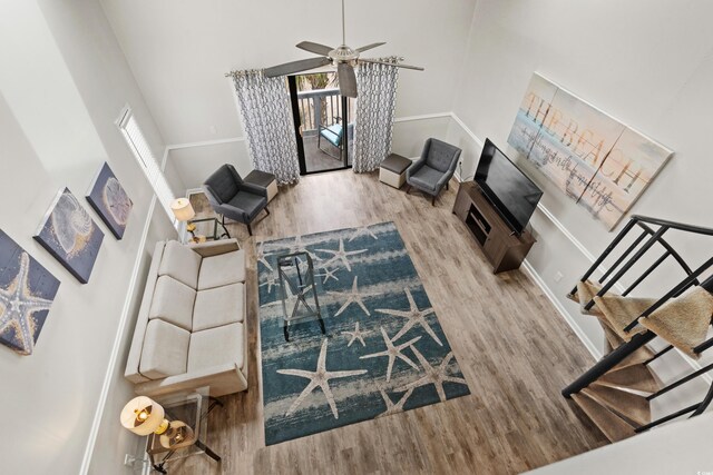 1891 Colony Dr Unit 15J, Surfside Beach, SC 29575 - living room with a high ceiling, wood finished floors, ceiling fan, and baseboards