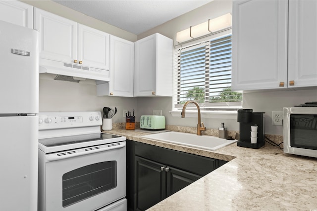 1891 Colony Dr Unit 15J, Surfside Beach, SC 29575 - kitchen featuring white appliances, under cabinet range hood, a sink, and white cabinetry