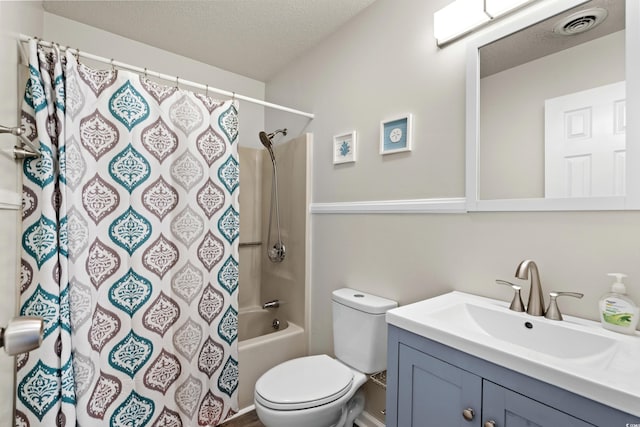 1891 Colony Dr Unit 15J, Surfside Beach, SC 29575 - bathroom with toilet, vanity, a textured ceiling, and shower / tub combo with curtain