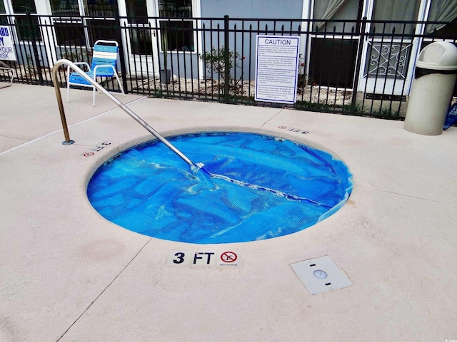 1891 Colony Dr Unit 15J, Surfside Beach, SC 29575 - view of pool featuring fence and a community hot tub