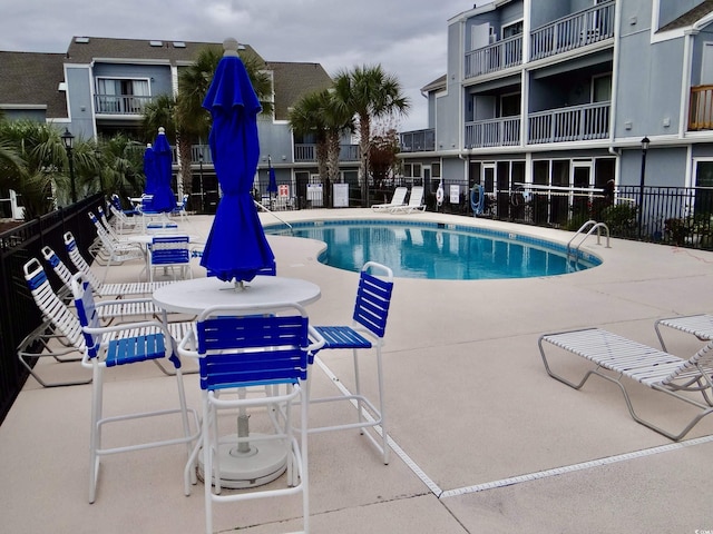 1891 Colony Dr Unit 15J, Surfside Beach, SC 29575 - community pool featuring a patio and fence