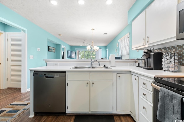 637 Waterway Village Blvd Unit 13C, Myrtle Beach, SC 29579 - kitchen featuring appliances with stainless steel finishes, a peninsula, a sink, light countertops, and white cabinetry