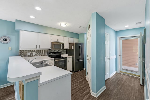 637 Waterway Village Blvd Unit 13C, Myrtle Beach, SC 29579 - kitchen featuring black / electric stove, stainless steel microwave, freestanding refrigerator, dark wood-style floors, and recessed lighting