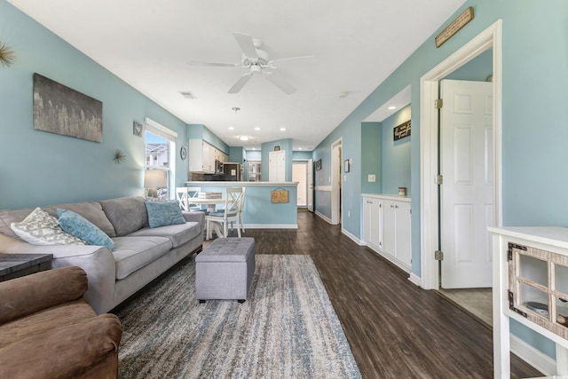 637 Waterway Village Blvd Unit 13C, Myrtle Beach, SC 29579 - living area featuring dark wood-type flooring, ceiling fan, and baseboards