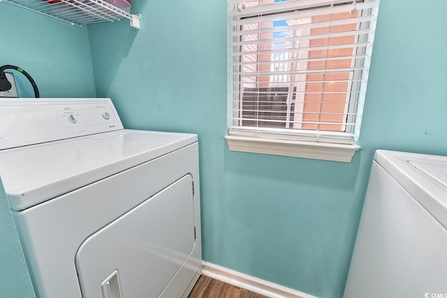 637 Waterway Village Blvd Unit 13C, Myrtle Beach, SC 29579 - laundry area featuring washer and dryer, baseboards, and wood finished floors