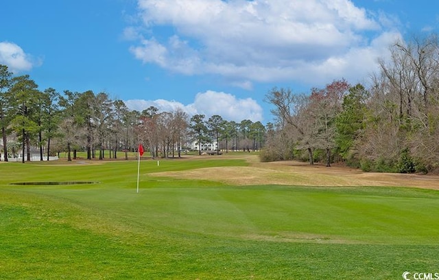 637 Waterway Village Blvd Unit 13C, Myrtle Beach, SC 29579 - view of community featuring a yard, view of golf course, and view of wooded area