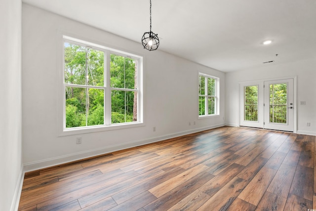 144 Puffin Dr Unit 2A, Pawleys Island, SC 29585 - spare room with hardwood / wood-style flooring, baseboards, and recessed lighting