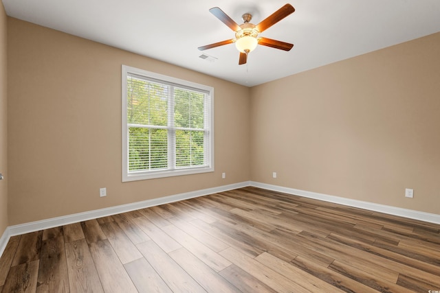 144 Puffin Dr Unit 2A, Pawleys Island, SC 29585 - unfurnished room with baseboards, wood finished floors, and ceiling fan