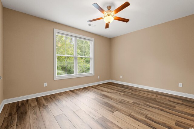 144 Puffin Dr Unit 2A, Pawleys Island, SC 29585 - unfurnished room with baseboards, wood finished floors, and ceiling fan