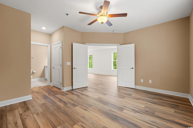 144 Puffin Dr Unit 2A, Pawleys Island, SC 29585 - empty room with ceiling fan, light wood-style flooring, baseboards, recessed lighting, and a pendent fire sprinkler