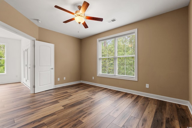 144 Puffin Dr Unit 2A, Pawleys Island, SC 29585 - unfurnished room featuring wood finished floors, baseboards, ceiling fan, and a smoke detector