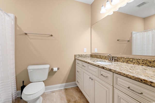 144 Puffin Dr Unit 2A, Pawleys Island, SC 29585 - bathroom featuring vanity, toilet, and baseboards