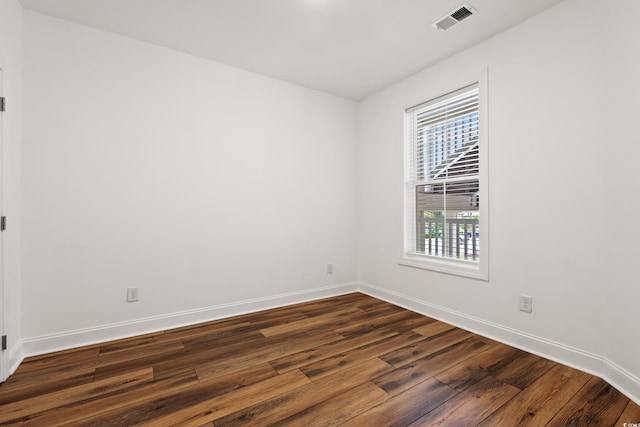 144 Puffin Dr Unit 2A, Pawleys Island, SC 29585 - empty room with dark wood-style floors and baseboards